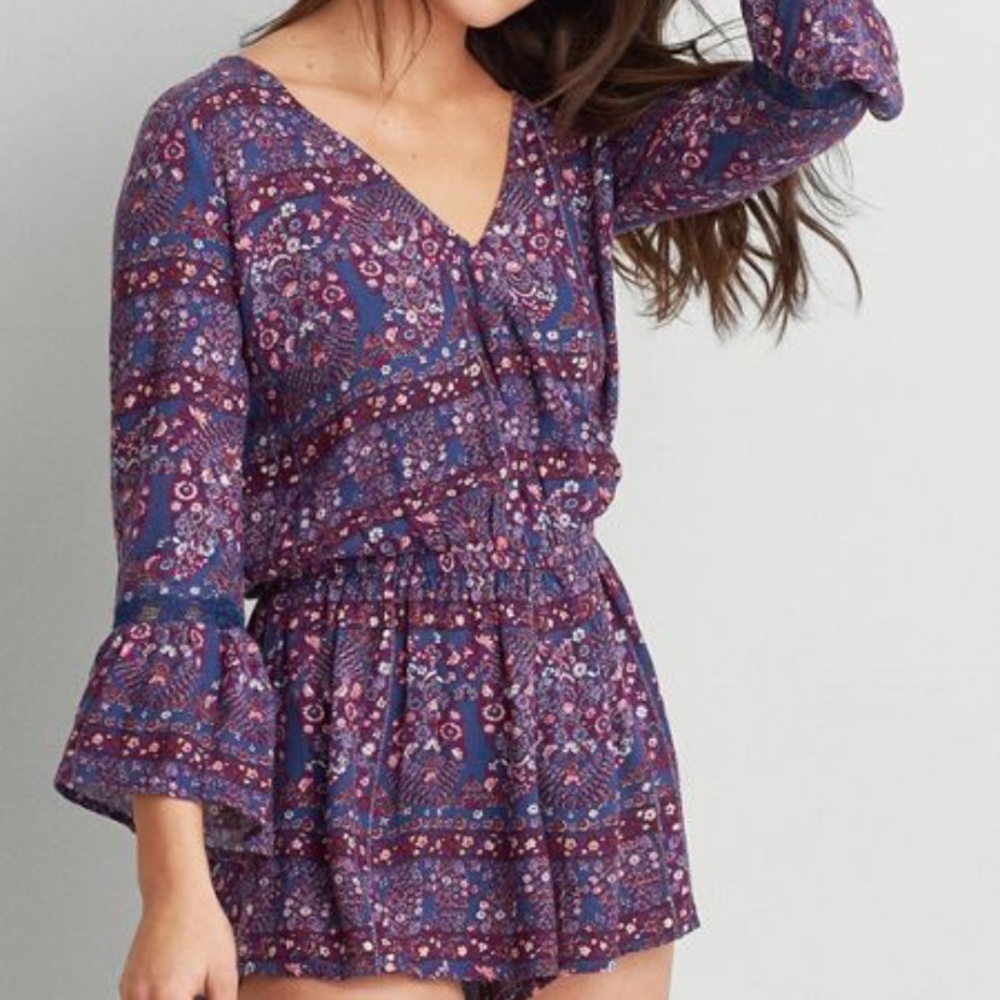 Purple and blue romper with lace cutouts on arms